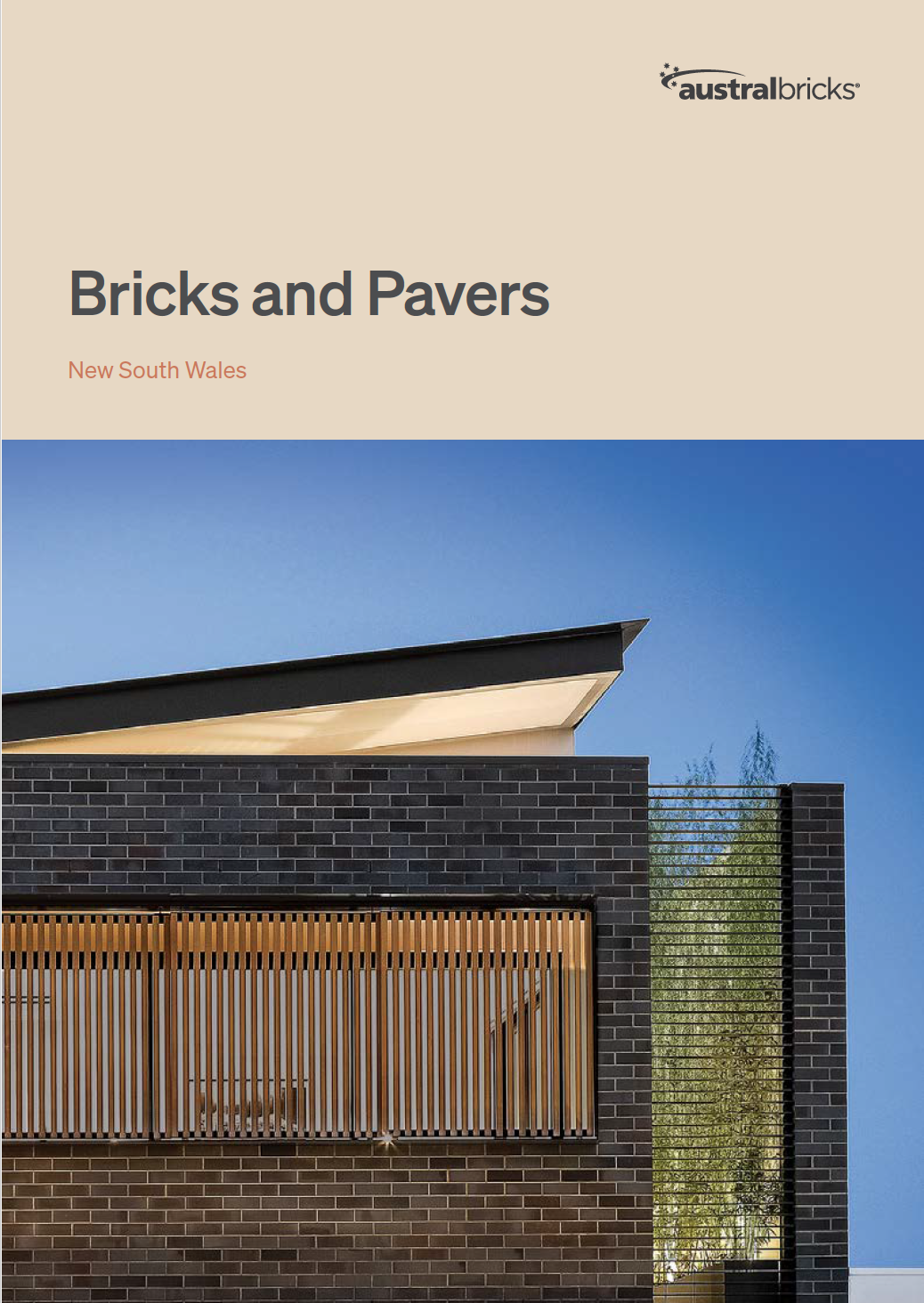 cover of the Austral Bricks and Pavers brochure. Bricks and Pavers written at the top of page with a modern box house built from dark brown bricks below it