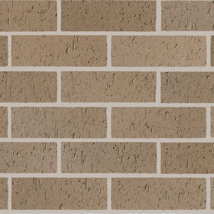 A wall constructed using the Whitsunday Brampton bricks, featuring a blend of light brown and tan tones reminiscent of the peaceful Whitsunday sands. These rectangular bricks are laid horizontally with consistent white mortar separating them. The surface has a rough, slightly uneven texture that captures an organic charm similar to the natural beauty of Brampton Island.