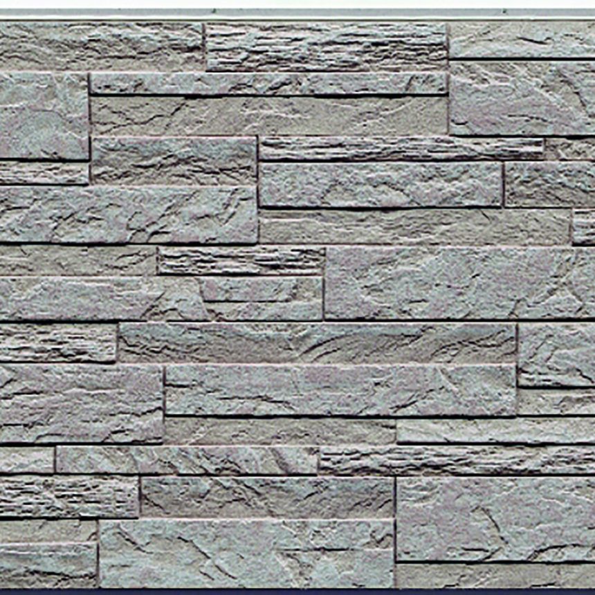 A close-up of a textured stone wall showcases the Innova Montage Stackstone Sandstone design, featuring rectangular grey stone tiles in a staggered layout. This arrangement results in a mosaic-like effect, emphasising the diverse shades and surface textures akin to natural sandstone.