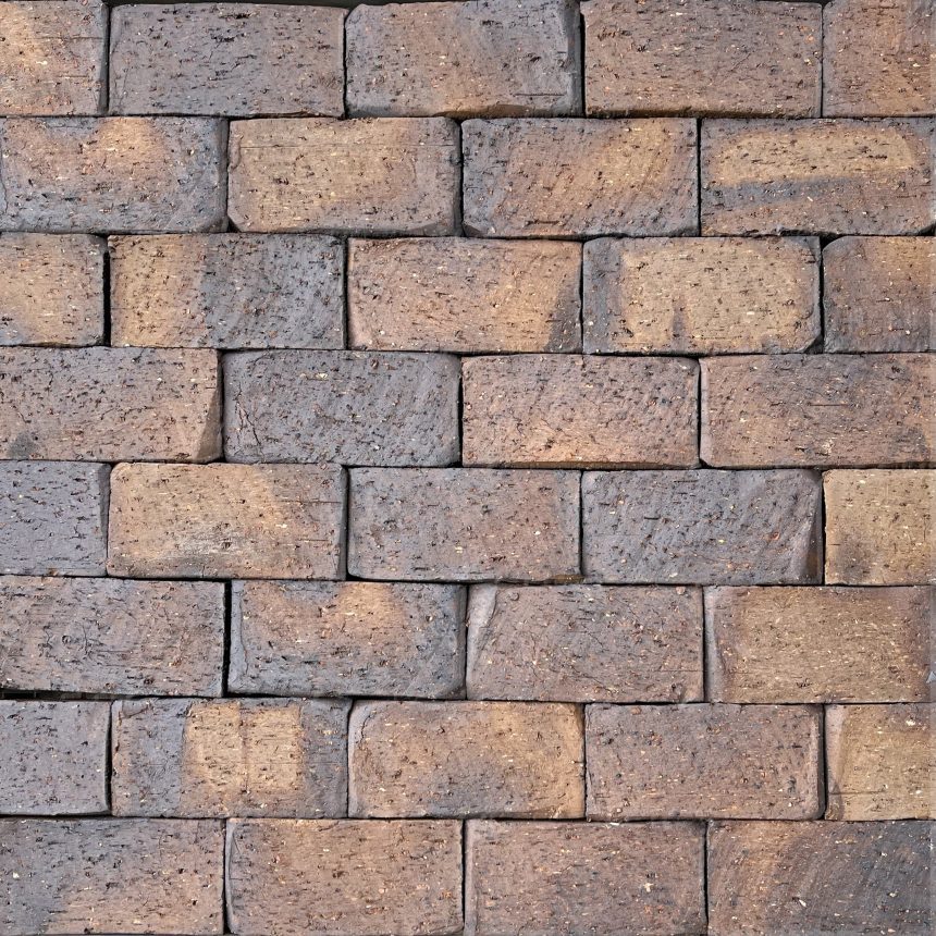 A close-up view showcases the Cobblestone Cannon, an irregular pattern of bricks blending brown and gray hues. The cobblestone-like texture imparts a rustic charm, reminiscent of an old cannon fortification.