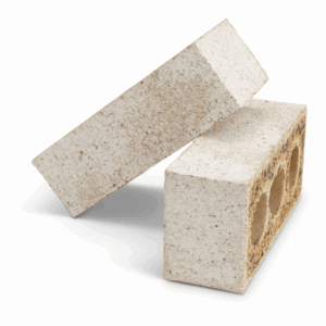 Two light tan rectangular bricks in the Coastal Hampton Washed White finish are shown on a white background. One brick lies flat, displaying three circular holes, while the other is positioned diagonally on top.