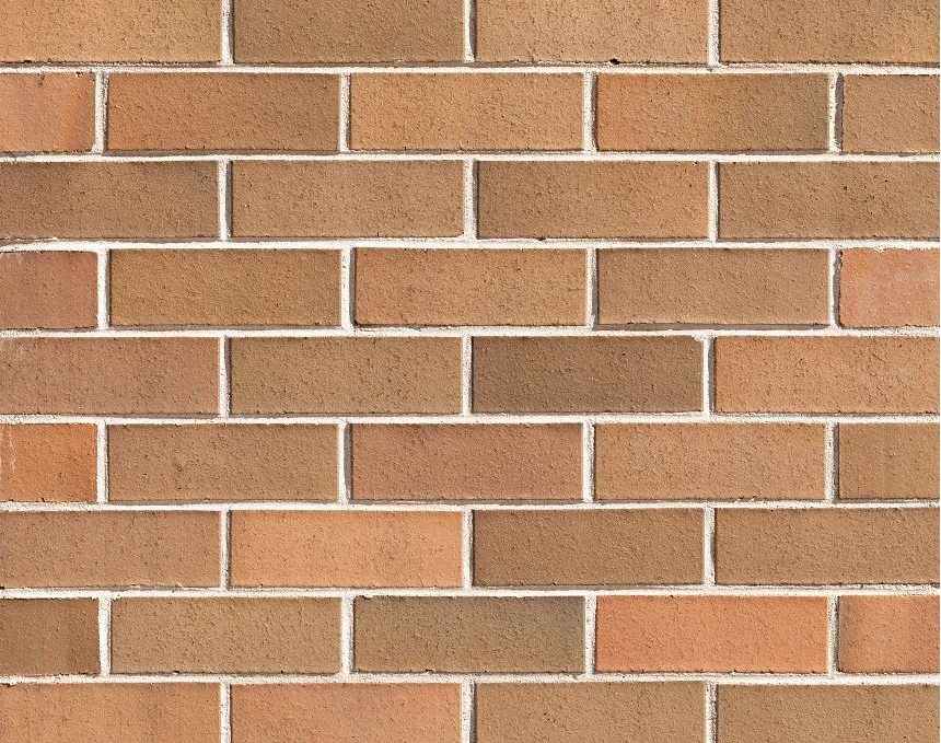 Close-up of a brick wall showcasing the Park Lane Grosvenor pattern, featuring brown and tan rectangular bricks that embody the classic architectural style reminiscent of Park Lane. These bricks are precisely aligned in horizontal rows with light-colored mortar, reflecting the timeless elegance associated with Grosvenor locations.