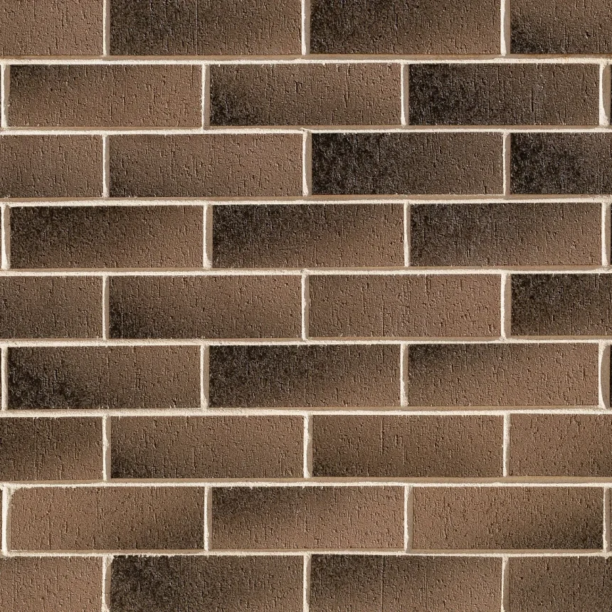 The wall, composed of a symmetrical pattern of Stratos Cloudy Sunset brick, displays a neat arrangement with light-coloured mortar, evoking the layered look of a stratos cloud. The slight variations in the shade of the tiles create a textured surface that mirrors the soft tones of a cloudy sunset.