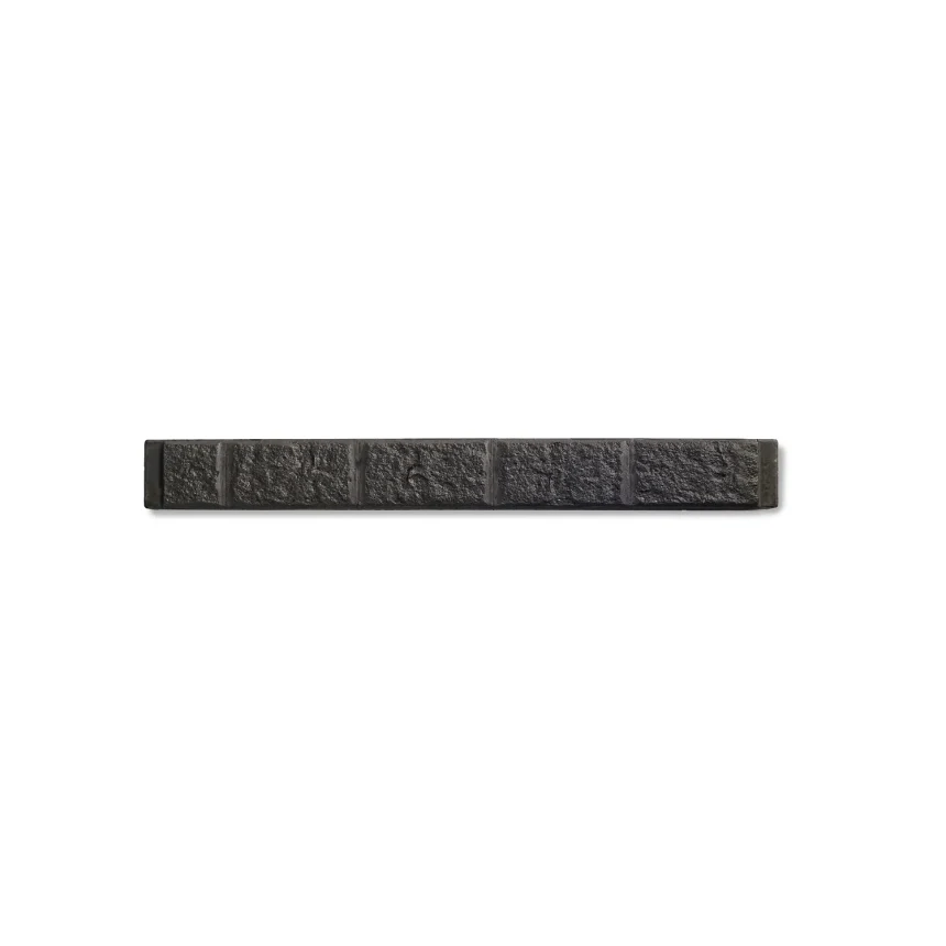 An elongated, narrow, rectangular black Explorer Sandstone Sleeper Graphite with a textured surface reminiscent of graphite is segmented into smaller rectangular sections along its length, and is set against a plain white background.
