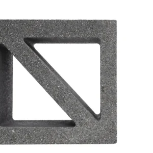 The image shows the GB Breeze Blocks Wedge Nickel—gray, with a triangular cutout and diagonal support—against a white background. Only the right half of this concrete block is visible.