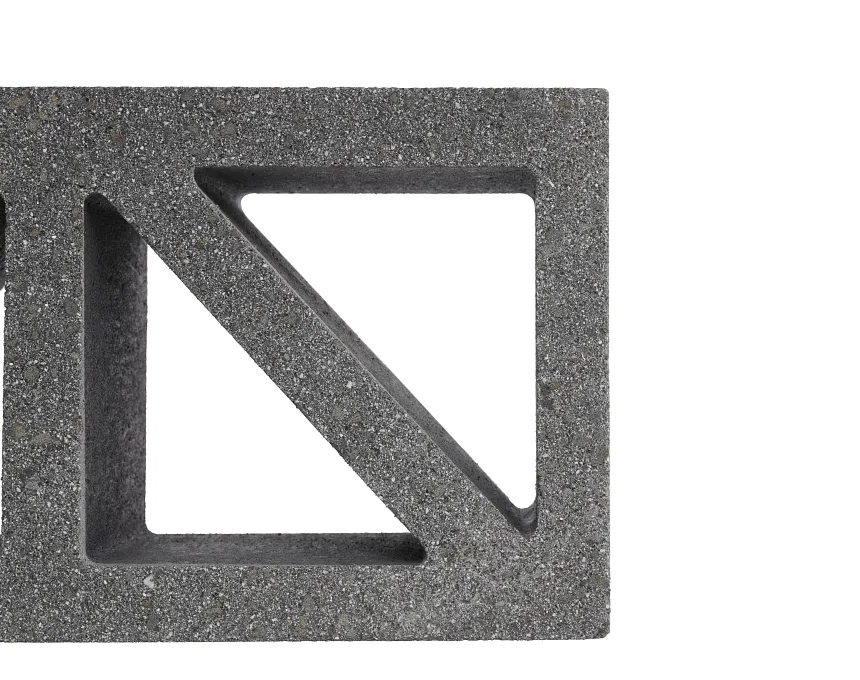 The image shows the GB Breeze Blocks Wedge Nickel—gray, with a triangular cutout and diagonal support—against a white background. Only the right half of this concrete block is visible.