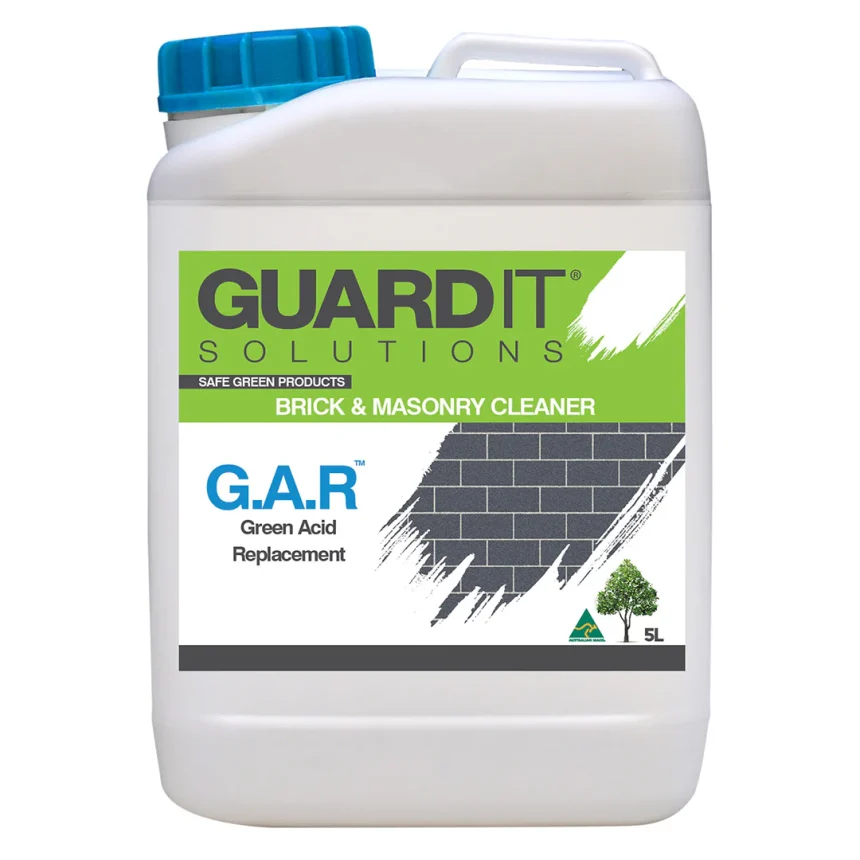 A 5-liter container of GuardIT GAR Green Acid Replacement features a label highlighting its function as an eco-friendly alternative to traditional acids. The design includes a brick wall graphic in the background and a small green tree icon, emphasizing its environmentally friendly attributes.