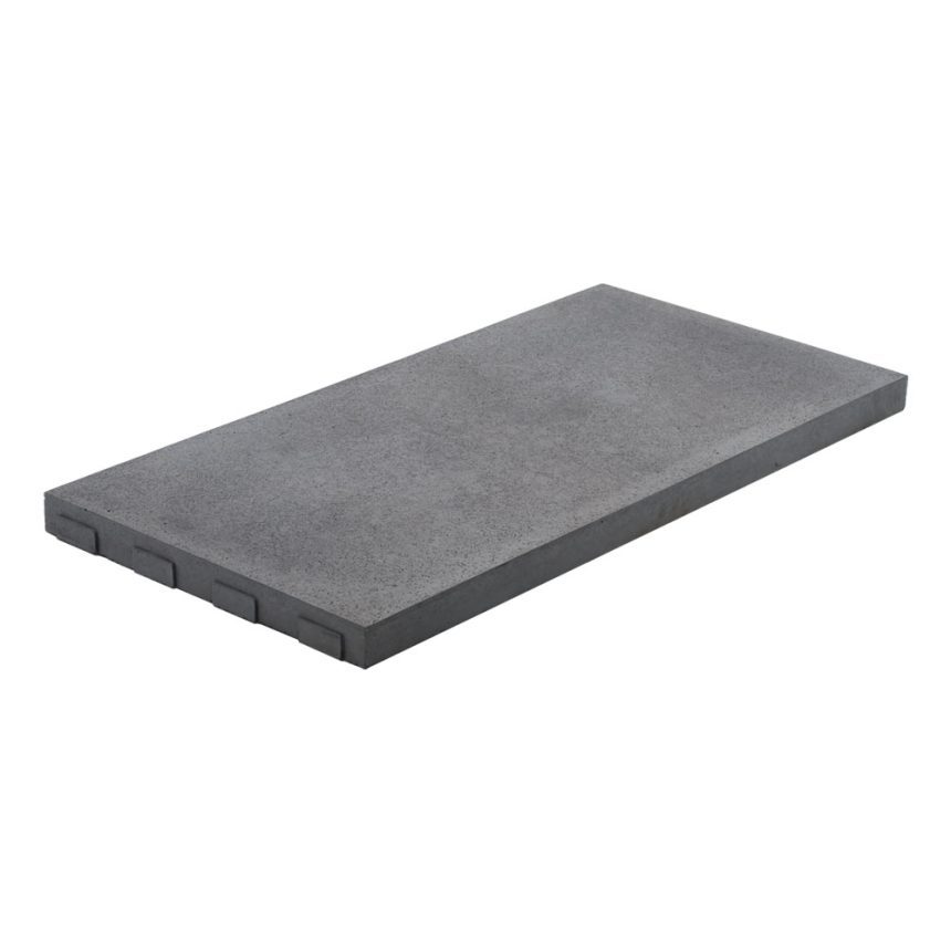 A rectangular concrete paver in grey from the Balistone Lovina collection is featured with a smooth surface and distinctive grooves on one side. It's stylishly set at an angle against a simple white background.