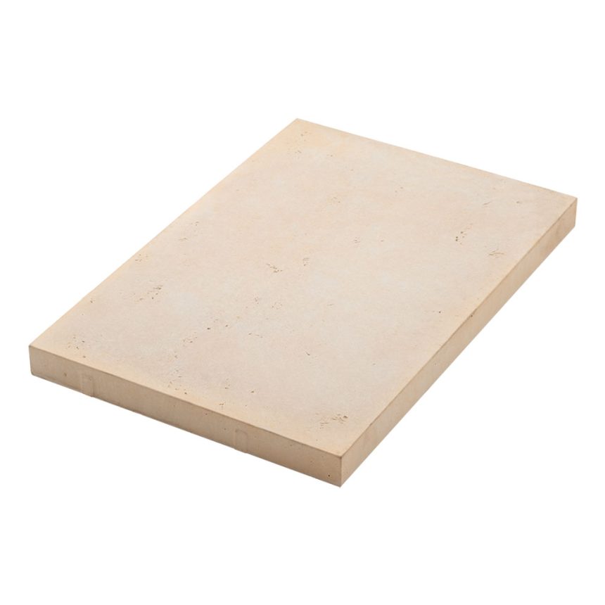 The Travertine 600 Smooth Chalk Paver, rectangular and beige-coloured, is showcased on a white background. Its smooth surface combined with a slightly rough, natural texture.