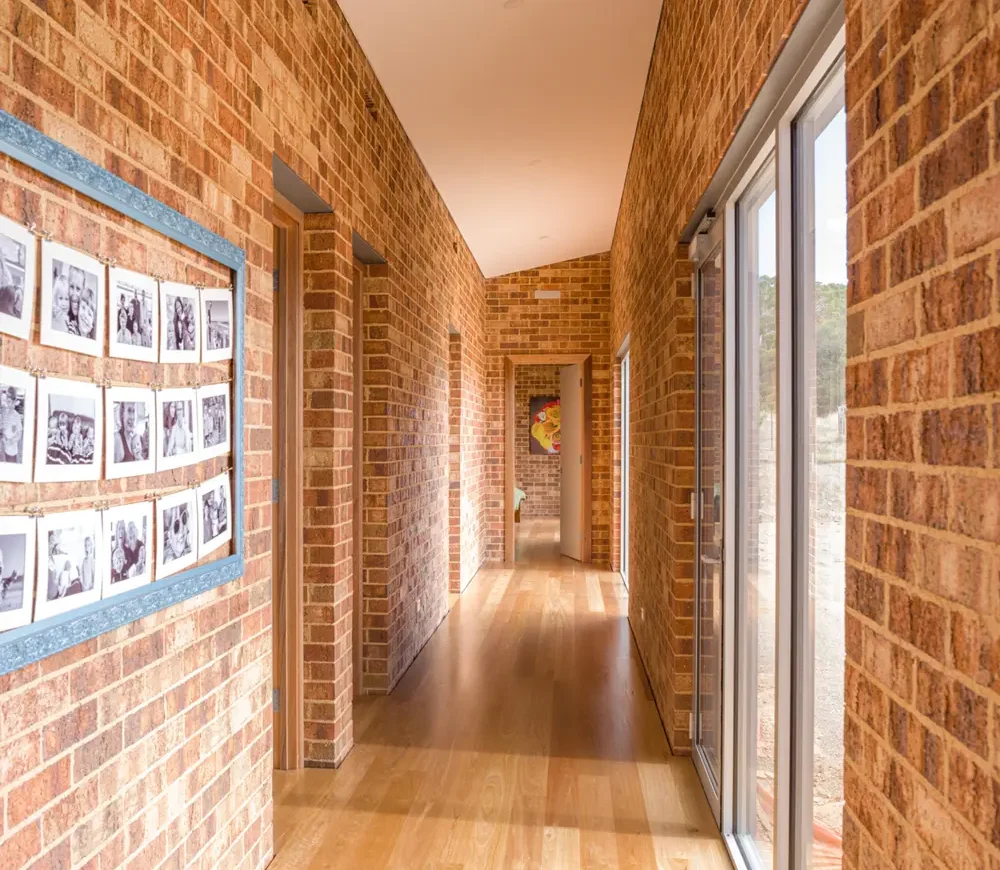 a hallway in a house using Littlehampton Brick, Flinders on the internal walls.