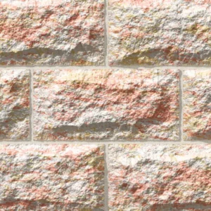 A close-up of a textured brick wall shows the rough surface and varied pink, beige, and light yellow tones of GB Sandstone Rockface Endeavour Blend (Copy), with thin gray mortar lines highlighting each uneven brick.