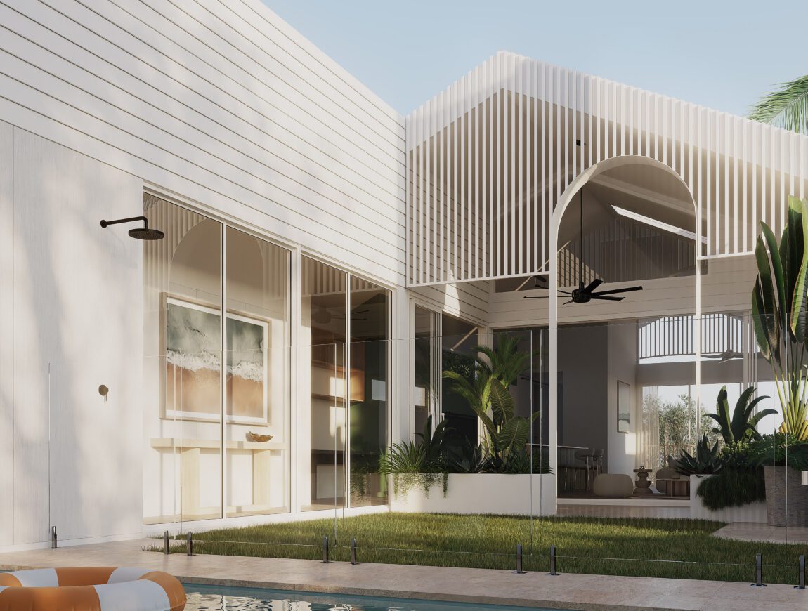 A modern house with white walls of Innova Fibre Cement and large windows surrounds a grassy courtyard and swimming pool. Tropical plants, a covered patio with fans, and a striped orange-and-white pool float create a relaxing vibe.