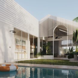 A modern house with white walls of Innova Fibre Cement and large windows surrounds a grassy courtyard and swimming pool. Tropical plants, a covered patio with fans, and a striped orange-and-white pool float create a relaxing vibe.