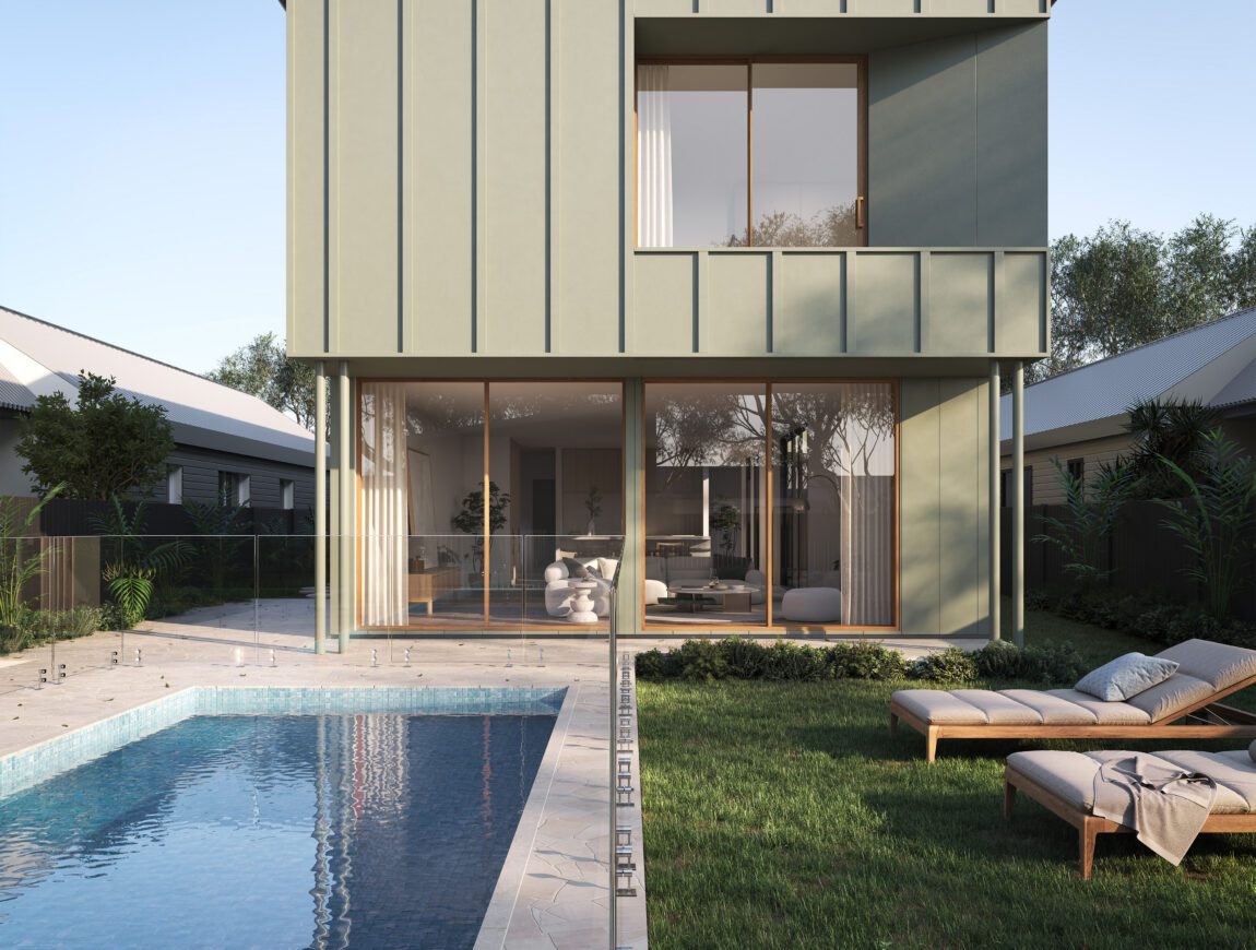 Modern two-story house with large windows features Innova Fibre Cement accents, a backyard patio, glass fencing, and a swimming pool. Two lounge chairs rest by the pool, surrounded by greenery and neighboring homes.