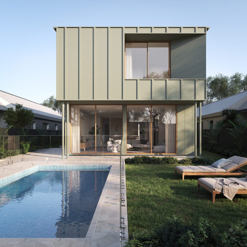 Modern two-story house with large windows features Innova Fibre Cement accents, a backyard patio, glass fencing, and a swimming pool. Two lounge chairs rest by the pool, surrounded by greenery and neighboring homes.