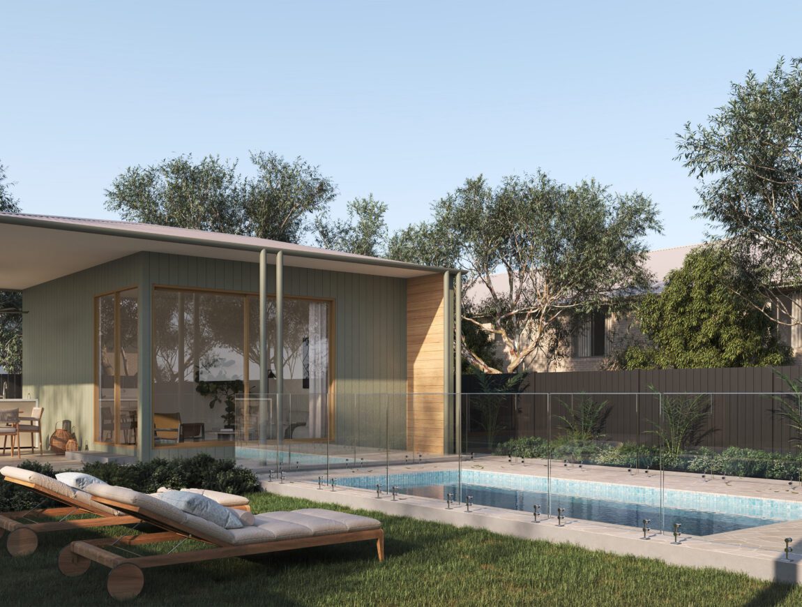 Modern backyard featuring a small pool with glass fencing, two wooden lounge chairs on grass, and a contemporary house with large Innova Fibre Cement windows. Outdoor dining area, trees, and a wooden fence complete the inviting space.