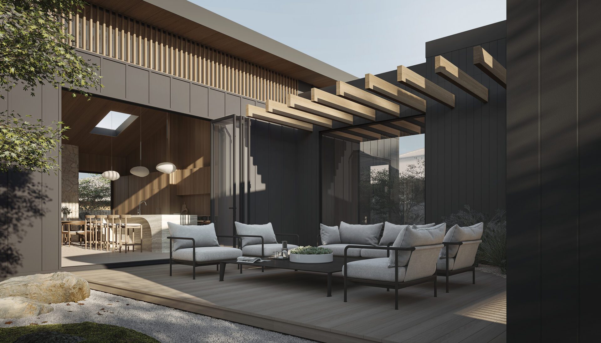 Modern outdoor patio with cushioned seating and a round coffee table on an Innova Fibre Cement deck. Large glass doors open to a stylish dining area with pendant lights and wooden accents as sunlight filters through an overhead pergola.