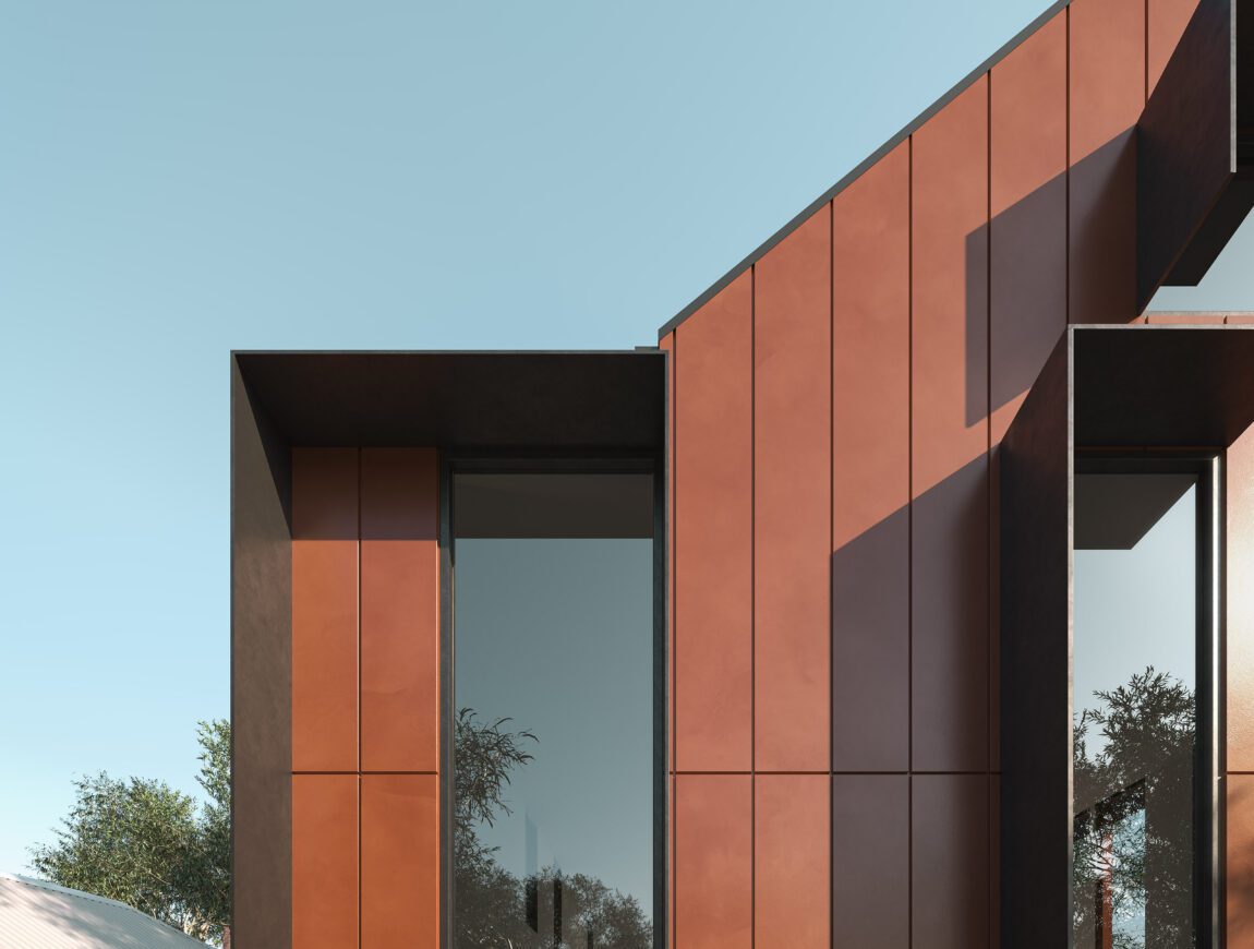 Modern house exterior with angular roof, large vertical windows, and rust-colored Innova Fibre Cement wall panels against a clear blue sky. Green trees and part of a neighboring white building are visible in the background.